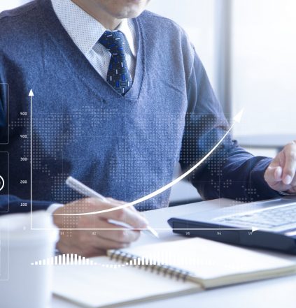 Businessman looking into a laptop computer notebook deeply reviewing financial reports for a return on investment or investment risk analysis.